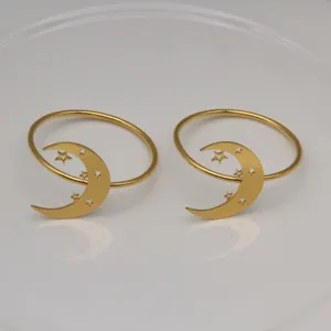 Gold metal napkin rings featuring a sweet crescent moon and star design for table settings.