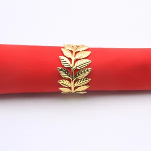 Exquisite gold metal leaf napkin ring close-up detail for elegant dining table decor