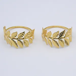 Gold metal leaf napkin ring detail view, elegant table decor and setting accessory.