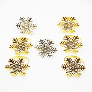 Detailed view of sparkling rhinestone snowflake napkin rings, elegant table decor for holidays.