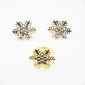 Detail shot of crystal rhinestone snowflake napkin rings, elegant table decor close-up.