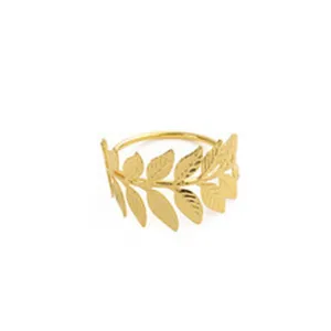 Gold metal leaf napkin ring detail close up view for dining table decor holder accessory