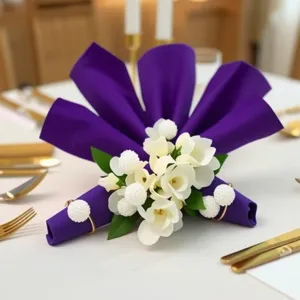 Gold metal napkin ring with white pearl beads, elegant table decor for hotel weddings.