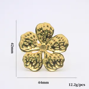 Golden flower napkin ring detail showing fine texture, precise dimensions, and alloy finish.