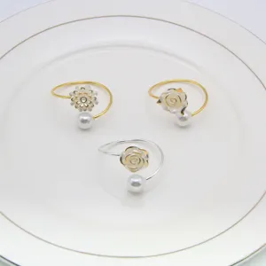 Elegant pearl and rose napkin rings set, perfect for wedding table decor and luxury banquets.