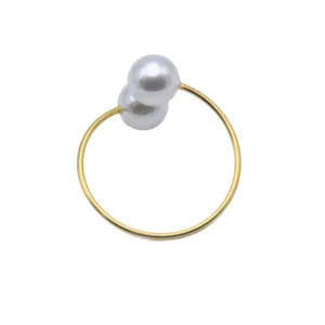Gold metal dual pearl napkin ring for wedding party home table decor holiday dinner setup.