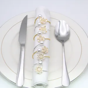 Elegant pearl rose napkin rings set for wedding table decor, luxury metal napkin holders.
