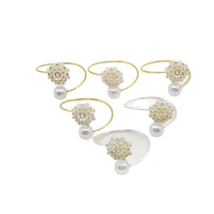 Elegant rose pearl napkin rings for wedding table setting, luxury gold and silver tissue holders.