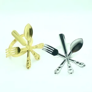 Elegant metal napkin rings with cutlery design in gold and silver, perfect for western dining.
