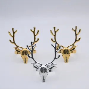 Exquisite deer head metal napkin rings in gold and silver, perfect for Christmas table decor.