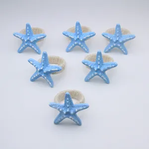 Blue resin starfish napkin ring detail view showcasing nice nautical table decor style