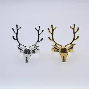 Silver gold metal deer head napkin rings set for Christmas table decor, elegant holiday items.