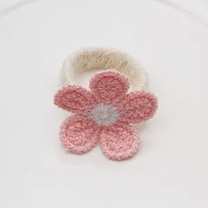 Handmade crochet pink flower napkin ring, elegant table decor for hotel wedding dinner.