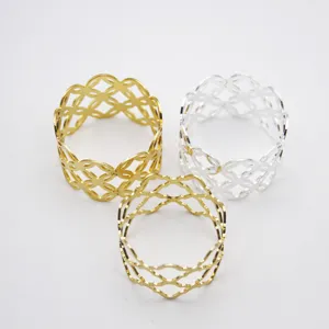 Set of 3 hollow metal napkin rings in gold and silver, elegant table decor for dining.