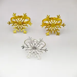 Metal snowflake napkin rings set, elegant table decor for Christmas and New Year parties.