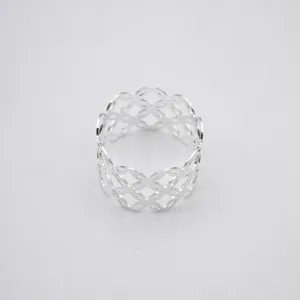 Close-up of silver hollow diamond napkin ring, showing fine metallic texture and pattern.