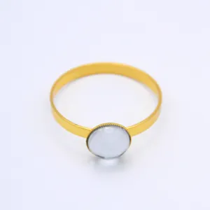 Gold metal napkin ring with 20mm round stone detail for elegant hotel and home table decoration.