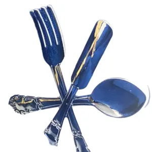 Metal cutlery shaped napkin ring for hotel western table decor, durable and elegant blue finish.