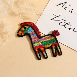 Detailed close-up of colorful embroidered pony patch, vibrant striped DIY accessory.