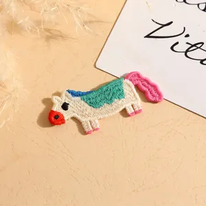 Embroidered cartoon pony patch with colorful threads, perfect for DIY clothing and phone case decor.