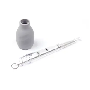 Silicone turkey baster oil dropper with cleaning brush and clear graduated measuring tube.