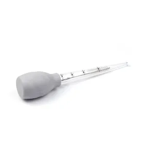 Silicone turkey baster oil dropper with graduated clear tube and cleaning brush for kitchen BBQ.