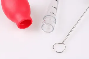 Silicone turkey baster with cleaning brush, clear graduated tube and red bulb for BBQ.