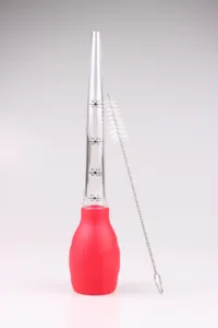 Silicone turkey baster and BBQ oil pump with clear measurement scale and cleaning brush detail.