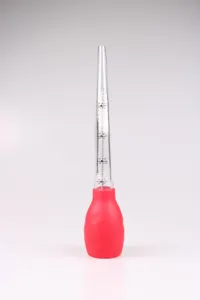 Detailed view of the silicone turkey baster with clear measurement marks and cleaning brush.