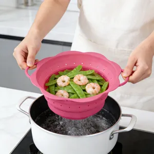 Collapsible silicone colander kitchen basket for washing and draining fruits and vegetables.