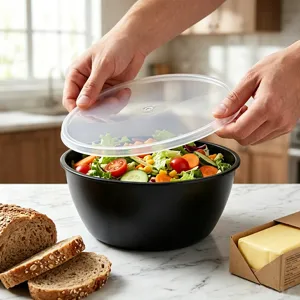 Bol de conservation en plastique alimentaire avec couvercle transparent pour la cuisine.