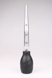Silicone turkey baster detail view, transparent scale tube and cleaning brush for BBQ cooking.