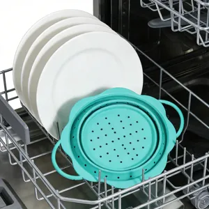 Collapsible silicone draining basket detail view, teal kitchen colander in dishwasher rack.