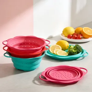 Detail view of collapsible silicone colanders for kitchen, showing draining holes and folded shape.