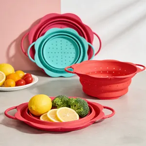 Collapsible silicone colander basket for kitchen vegetable and fruit draining use.