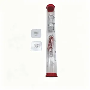 Detailed view of transparent acrylic cylinder bird feeder with red caps and wall hooks.