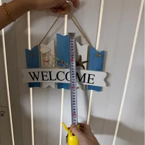 Nautical wooden welcome sign for home wall decor, beach themed hanging plaque with net.