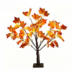 LED maple leaf tree light detail showing warm glowing lights and realistic autumn foliage.