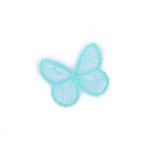 Light blue organza butterfly embroidered patch, sheer apparel DIY craft accessory.