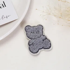 Gray fuzzy bear embroidery patch clothing accessory, perfect for jeans and jackets DIY decoration.