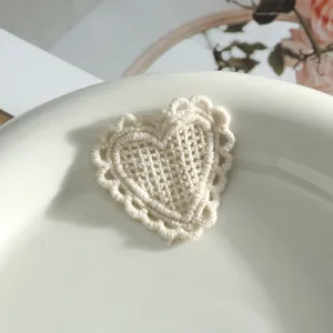 Beige crochet heart embroidery patch, self-adhesive DIY lace badge for clothing and crafts.