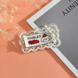 Cute lace embroidered patch detail featuring a charming puppy design with delicate bow and lace trim.