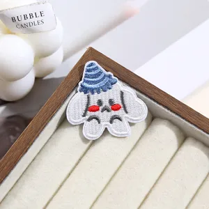 Cute cartoon puppy embroidered patch detail, ideal for clothing repair and decoration.