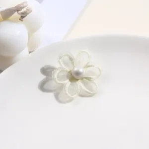 White lace flower patch detail with pearl center, ideal for DIY clothing decoration and repair.