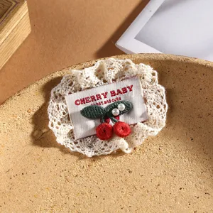 Detailed view of handmade lace cherry embroidered patch, perfect for DIY clothing and hair accessories.