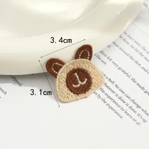 Close-up of a cute bear embroidery patch, detailed woven accessory for DIY crafts.