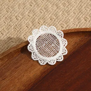 White lace embroidered flower patch, round DIY clothing repair accessory for garments.