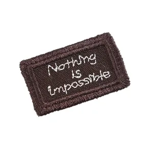 Brown embroidered patch with inspirational quote for DIY sewing, clothing accessories.