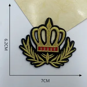 Detailed close-up of a golden crown embroidery patch with laurel wreath, measuring 6.2x7cm.