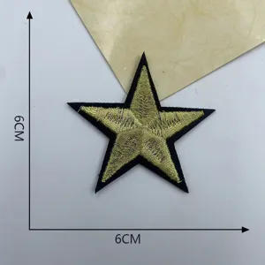 Gold star embroidered patch detail view, sparkling applique badge for DIY clothing and crafts.